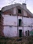 Разрушенное здание школы на Первомайском